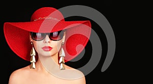 Woman in red hat and sunglasses