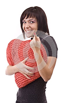 Woman with red heart-shaped pillow