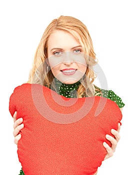 Woman with red heart-shaped pillow