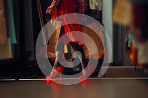 Woman in Red High Heels Shopping in Fashion Store