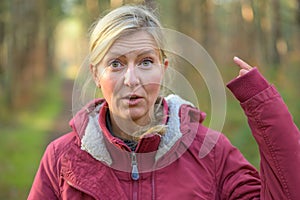 Woman in red jacket showing her long sleeve