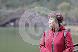 Woman in red by lake of jiuxianshan mountain, adobe rgb