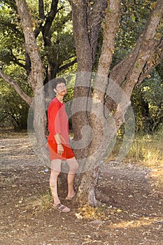 Woman in red in Landscape of oaks grove Kibbutz Kfar Glikson in northwestern Israel.