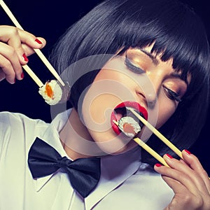 Woman with red lips eating sushi