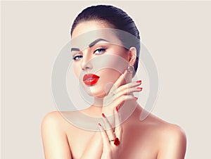 woman with red lips and nails closeup