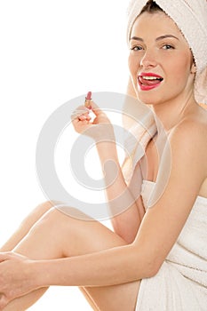 Woman with red lipstick licking her lips