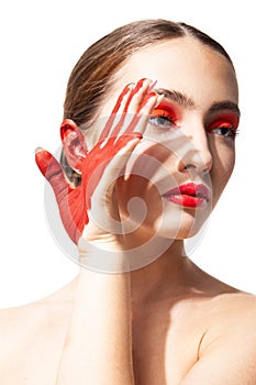 Woman with red makeup and painted hand