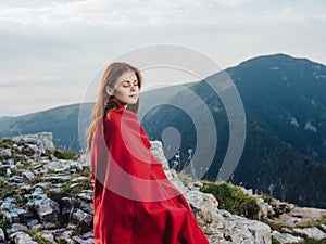 woman in red plaid in mountains landscape nature lifestyle photo