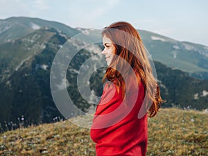 woman in a red plaid in the mountains outdoors fresh air cool photo