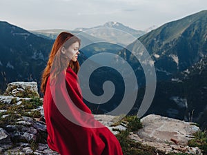 woman in a red plaid in the mountains outdoors fresh air cool photo