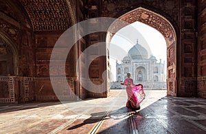 Woman in red saree/sari in the Taj Mahal, Agra, Uttar Pradesh, India