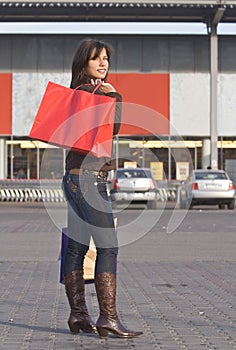 Woman with red shopping bag
