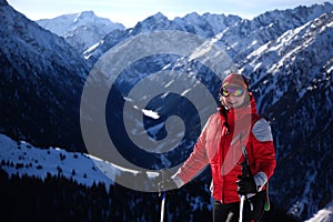 Woman in red on ski slope