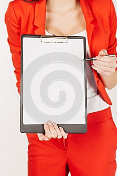 woman in red suit showing with the blank page of clipboard. isolated on white background. business and lifestyle concept.