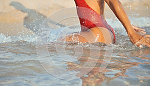 woman in red swimsuit has relax on beach