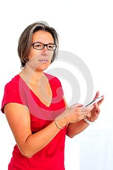 Woman in red t shirt on smartphone in studio