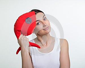 A woman with a red toy fish