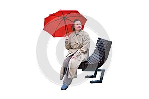 A woman with a red umbrella sits on a city street bench, isolated on a