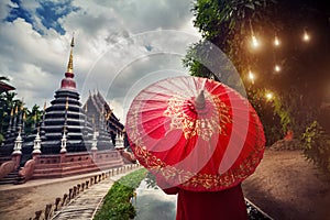 Woman with red umbrella in Thailand