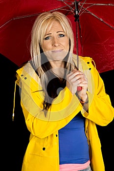 Woman red umbrella and yellow jacket funny expression