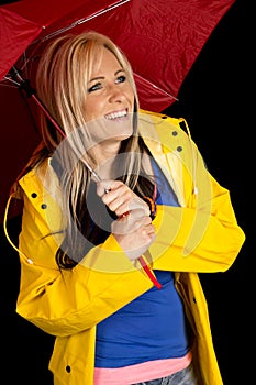 Woman red umbrella and yellow jacket happy