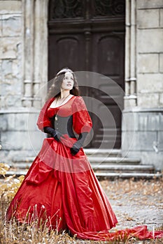 Woman in a red Victorian dress