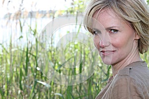 Woman by reeds