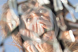 Woman reflection in broken mirror
