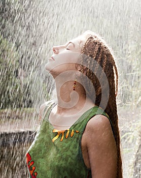 Woman refreshing in the rain