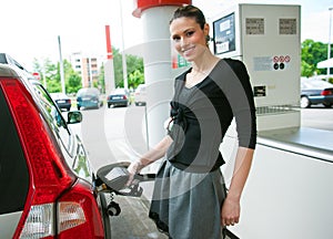 Woman refuel her car photo