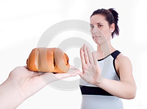 Woman refuses muffins isolated