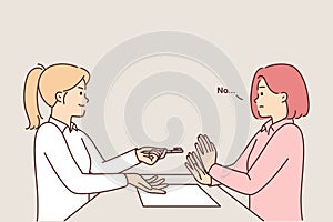 Woman refuses to sign contract sitting at table and does not want to take pen from HR manager girl