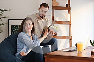 Woman refusing to take bouquet from her boyfriend