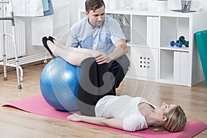 Woman during rehabilitation exercising