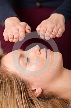 Woman in reiki healing session