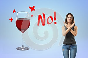 Woman rejecting wine with a clear no sign