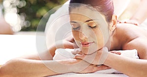 Woman, relax and back massage at spa sleeping for healthy wellness, skincare or stress relief at the resort. Calm female