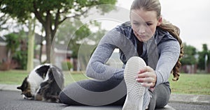 Woman, relax and stretching legs on floor in yoga for workout, exercise or outdoor training in health and wellness. Calm