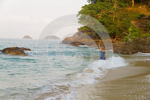 Woman relax with wave morning in Lonely Beach