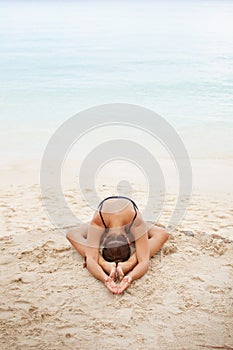 Woman In Relaxation On Tropical Beach with sand , body parts .yoga, and meditation