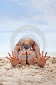 Woman In Relaxation On Tropical Beach with sand , body parts .yoga, and meditation