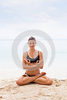 Woman In Relaxation On Tropical Beach with sand , body parts .yoga, and meditation