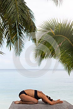 Woman In Relaxation On Tropical Beach with sand , body parts .yoga, and meditation