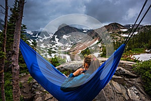 Woman relaxes on a hammock lake Isabelle Colorado