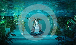 Woman relaxes underwater in a flooded room