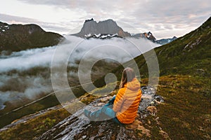 Woman relaxing alone in mountains travel adventure