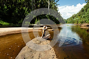 Woman relaxing along the shallows of the Grose River