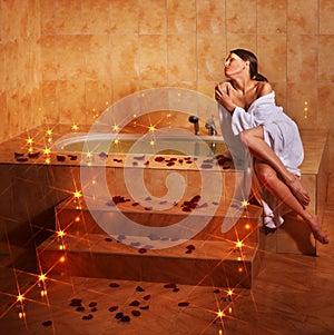 Woman relaxing in bath.