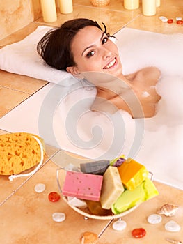 Woman relaxing in bath.