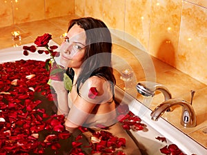 Woman relaxing in bath.